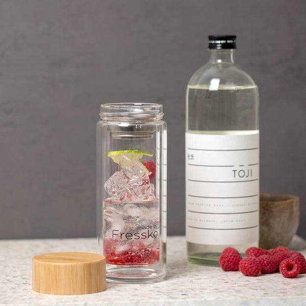 Lime and raspberry sake cocktail in RISE Fressko glass flask