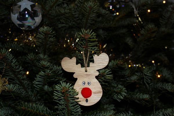 Cute wooden reindeer decoration on Christmas tree